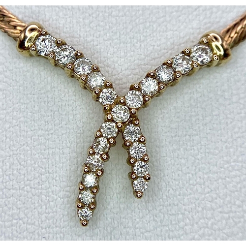 107 - A 9K Yellow Gold Herringbone Necklace with an Attached Eternal Crossover Diamond Pendant. 40cm neckl... 