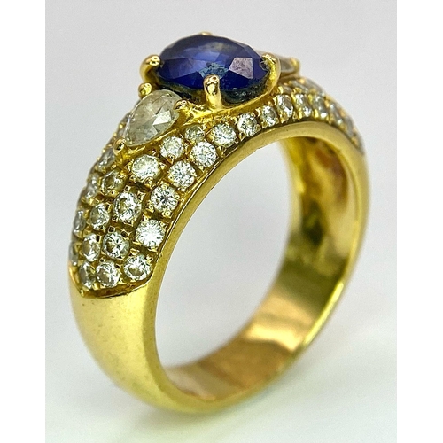 123 - Two Spectacular 18K Gold Rings. A sapphire and diamond ring - central oval sapphire with pave diamon... 