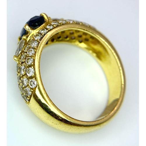 123 - Two Spectacular 18K Gold Rings. A sapphire and diamond ring - central oval sapphire with pave diamon... 