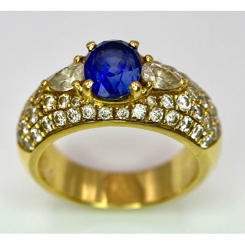 123 - Two Spectacular 18K Gold Rings. A sapphire and diamond ring - central oval sapphire with pave diamon... 