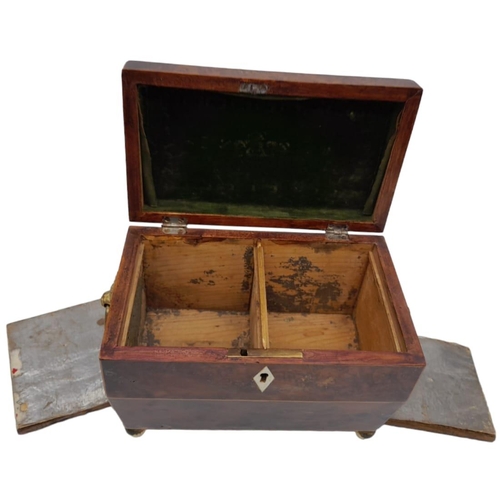 149 - A GEORGIAN WALNUT TEA CADDY WITH BRASS BALL FEET AND ORNATE RING HANDLES , TWIN TEA COMPARTMENTS .  ... 