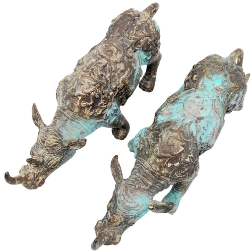 156 - A PAIR OF VERY EARLY ANTIQUE CHINESE BRONZE WARE CEREMONIAL RHINOCEROSES WITH DRAGON ON FLANKS, ONE ... 