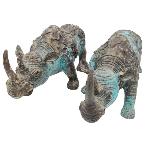 156 - A PAIR OF VERY EARLY ANTIQUE CHINESE BRONZE WARE CEREMONIAL RHINOCEROSES WITH DRAGON ON FLANKS, ONE ... 