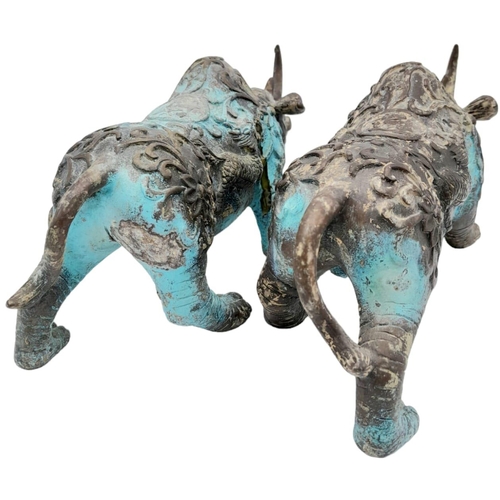 156 - A PAIR OF VERY EARLY ANTIQUE CHINESE BRONZE WARE CEREMONIAL RHINOCEROSES WITH DRAGON ON FLANKS, ONE ... 