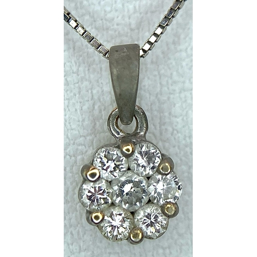 255 - A 18K WHITE GOLD 0.20CT  DIAMOND CLUSTER PENDANT ON CHAIN. TTOAL WEIGHT 1.7G