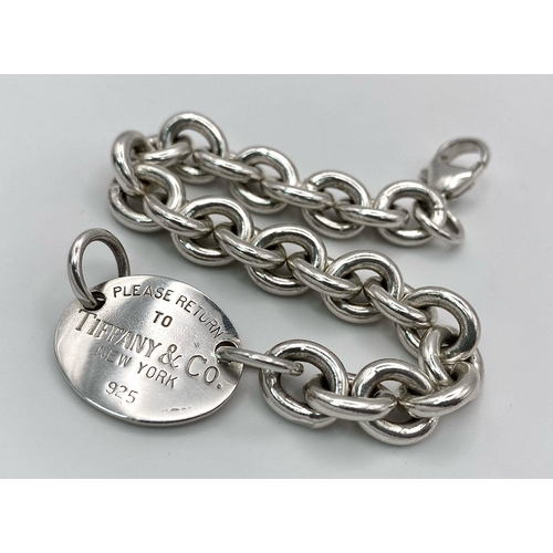 276 - A STERLING SILVER CHARM BRACELET. TOTAL WEIGHT 34.3G