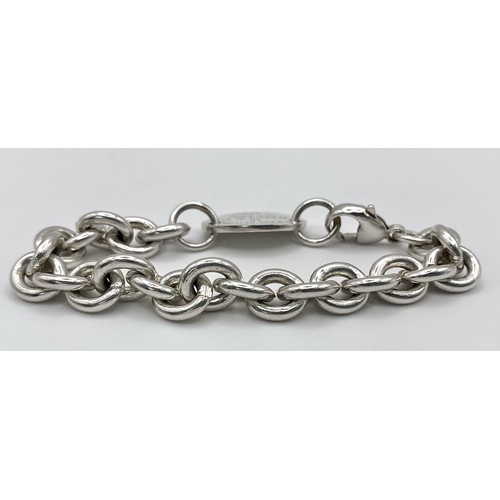 276 - A STERLING SILVER CHARM BRACELET. TOTAL WEIGHT 34.3G