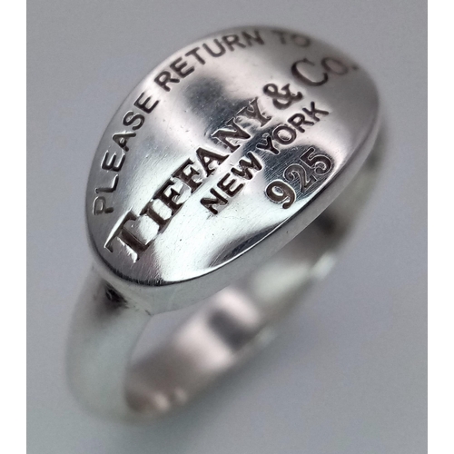 48 - A Please Return to Tiffany & Co. Silver Signet Ring. Comes with a Tiffany pouch. Size O. Ref: 016081