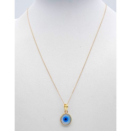 309 - An Evil Eye 18k Gold Pendant on an 18K Gold Disappearing Necklace. 20mm and 44cm. 1.85g total weight... 