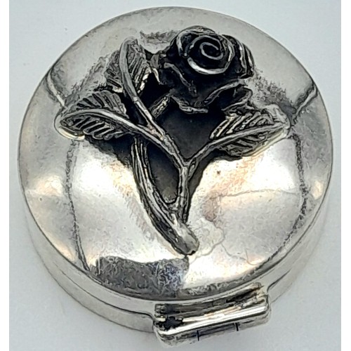 1422 - A Vintage Sterling Silver Trinket Box with Ornate Rose Decoration. 25mm diameter.