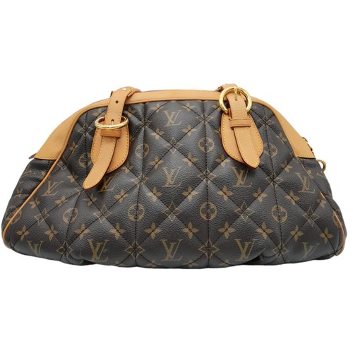 31 - A Louis Vuitton Monogram Etoile Bowling Bag. Quilted leather exterior with gold-toned hardware, padl... 