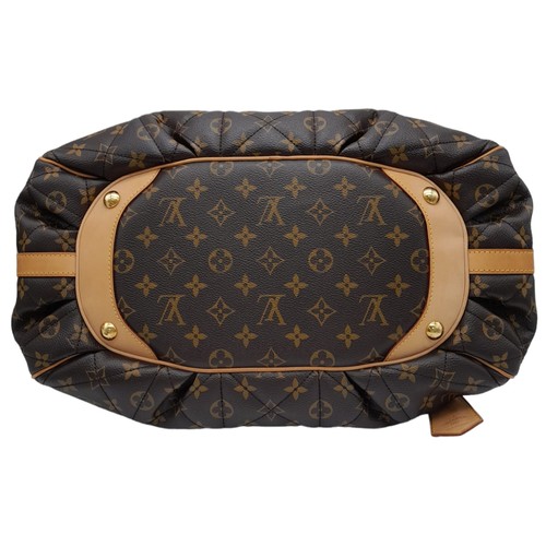 31 - A Louis Vuitton Monogram Etoile Bowling Bag. Quilted leather exterior with gold-toned hardware, padl... 