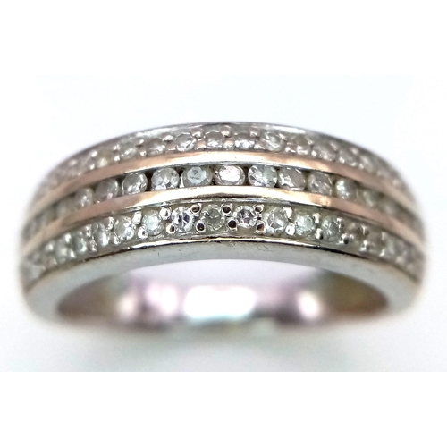 116 - An 18K White Gold Diamond Three Row Half Eternity Ring. 0.34ctw of diamonds. Size L. 3.5g total weig... 