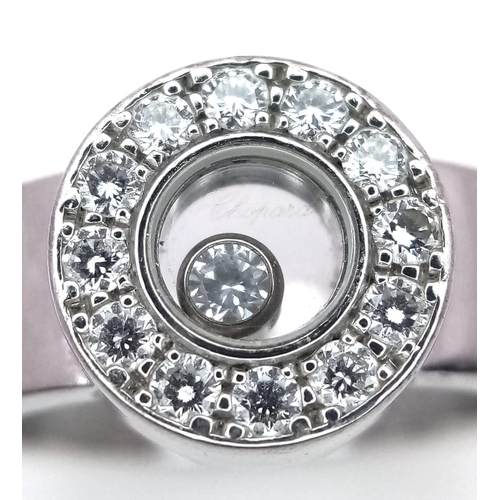 135 - An 18K White Gold Chopard Designer Floating Diamond Ring. 
A brilliant round cut diamond floats with... 