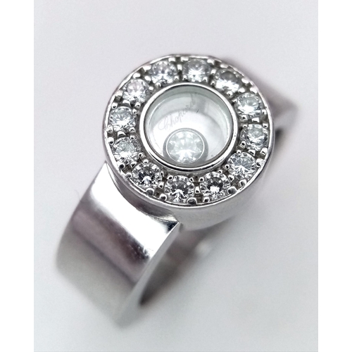 135 - An 18K White Gold Chopard Designer Floating Diamond Ring. 
A brilliant round cut diamond floats with... 