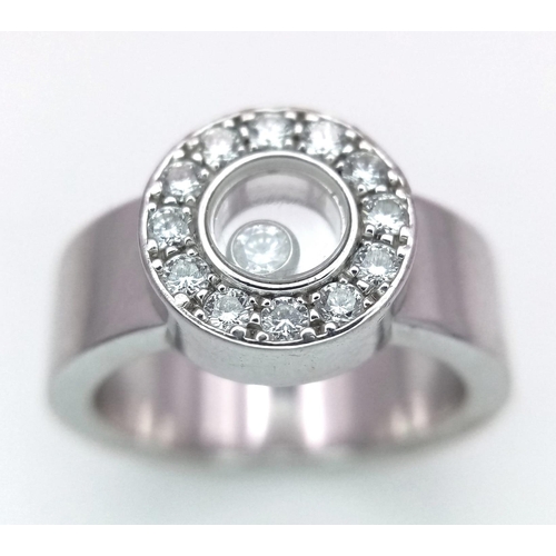 135 - An 18K White Gold Chopard Designer Floating Diamond Ring. 
A brilliant round cut diamond floats with... 