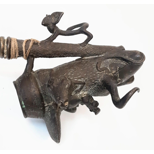 225 - An Antique Bronze Two-Piece Pipe. Gothic, almost Satanic Decorative Base. 66cm length.