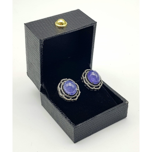 331 - A Pair of Pale Blue Tanzanite Cabochon Gemstone Earrings with Diamond Surrounds set in 925 Silver. T... 