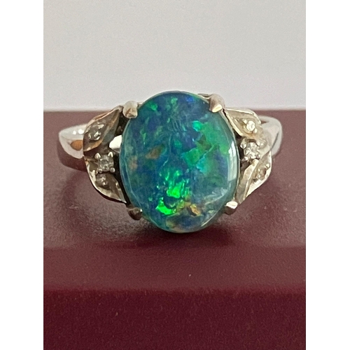 56 - 18 carat WHITE GOLD and FIRE OPAL RING. Having a 2 carat Green Fire Opal mounted to top with DIAMOND... 