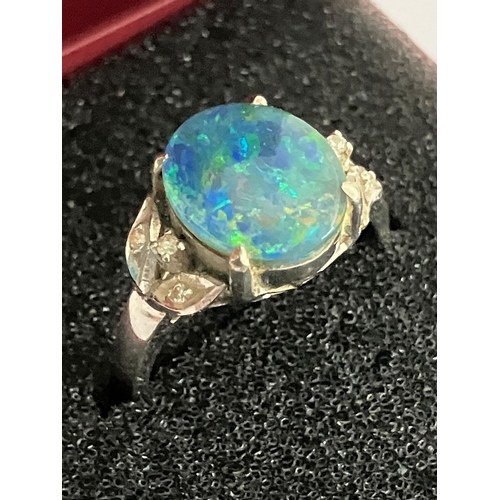 56 - 18 carat WHITE GOLD and FIRE OPAL RING. Having a 2 carat Green Fire Opal mounted to top with DIAMOND... 