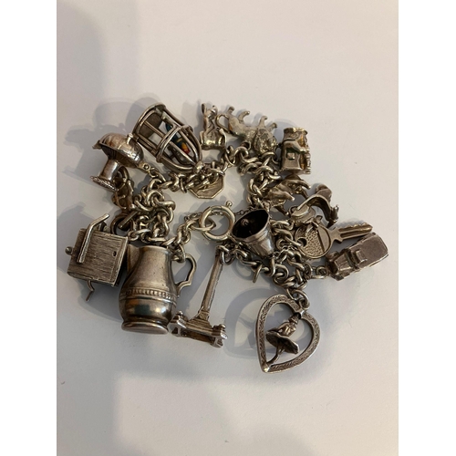 721 - Vintage SILVER CHARM BRACELET Having some really rare and unusual Silver charms.To include: barrel o... 