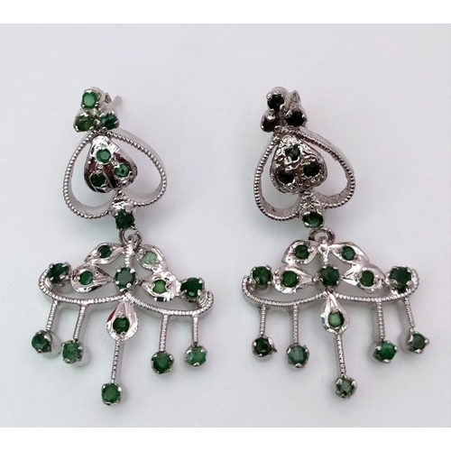 1761 - A Pair of Emerald Art Deco Style Earrings set in 925 Sterling silver. 10ctw. W-11g. 4cm drop. Comes ... 