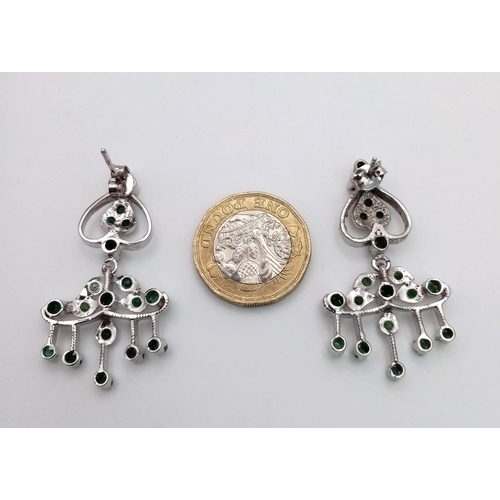 1761 - A Pair of Emerald Art Deco Style Earrings set in 925 Sterling silver. 10ctw. W-11g. 4cm drop. Comes ... 