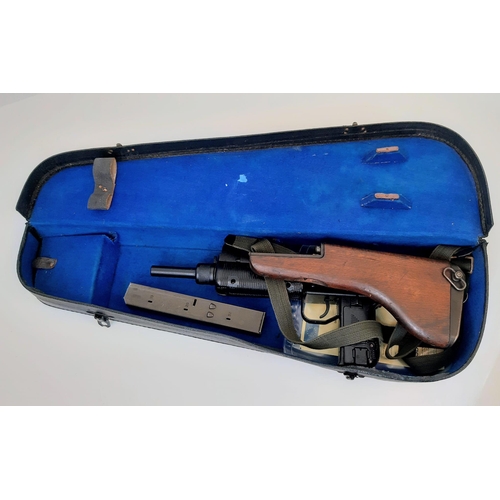 101 - A Deactivated Uzi 9mm Sub-Machine Gun. Nice condition with: Removable magazine, wood stock, sling an... 