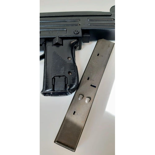 101 - A Deactivated Uzi 9mm Sub-Machine Gun. Nice condition with: Removable magazine, wood stock, sling an... 