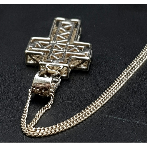 114 - An 18K White and Yellow Gold Diamond Encrusted Cross Pendant on an 18K White Gold Disappearing Neckl... 