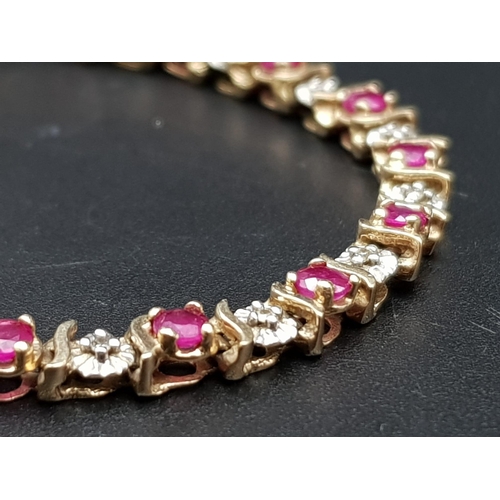 117 - A 9K YELLOW GOLD DIAMOND & RUBY SET BRACELET. TOTAL WEIGHT 6.7G