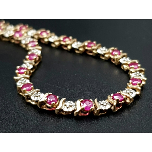 117 - A 9K YELLOW GOLD DIAMOND & RUBY SET BRACELET. TOTAL WEIGHT 6.7G