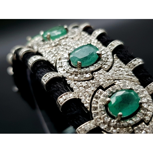 12 - An Asian Inspired Emerald and Diamond Bracelet set in a Woven Black Textile. 10ctw of oval cut emera... 