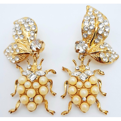 151 - A Wonderful Pair of Designer Dolce and Gabbana Dress Earrings. Two ladybirds amongst white stone foi... 