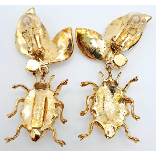 151 - A Wonderful Pair of Designer Dolce and Gabbana Dress Earrings. Two ladybirds amongst white stone foi... 