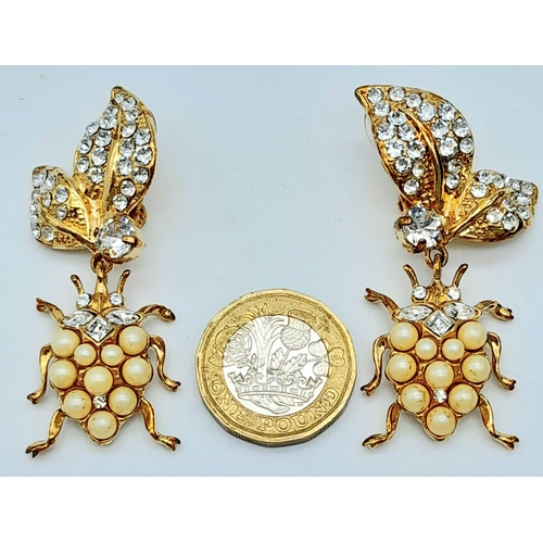 151 - A Wonderful Pair of Designer Dolce and Gabbana Dress Earrings. Two ladybirds amongst white stone foi... 