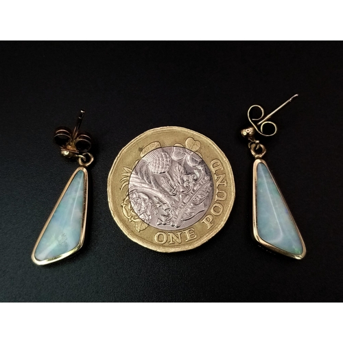 312 - A PAIR OF 9K YELLOW GOLD OPAL SET DROP EARRINGS. TOTAL WEIGHT 2.8G