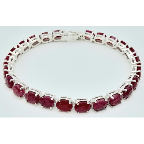 324 - A Ruby Gemstone Tennis Bracelet set in 925 Silver. 18cm. 17.2g weight. Ref: CD-1154