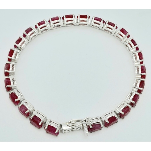 324 - A Ruby Gemstone Tennis Bracelet set in 925 Silver. 18cm. 17.2g weight. Ref: CD-1154