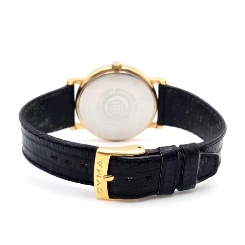 428 - A Cyma Quartz Moonphase Watch. Black leather strap. Gilded case - 32mm. White dial with three sub di... 