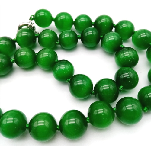 1579 - A Green Cat's Eye Beaded Necklace. 12mm beads. 42cm necklace length