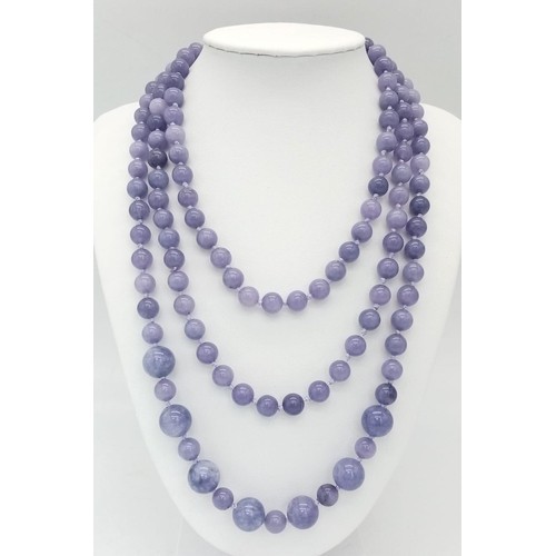 1809 - A Rope Length Graduated Lavender Jade Bead Necklace. Perfect for different wearing arrangements. 140... 