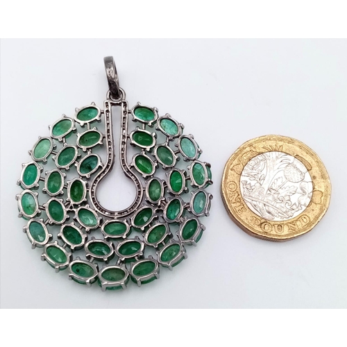 226 - An Emerald Circular Pendant with 13.55ct of Emeralds and 0.40ct of Diamond Accents set in 925 Silver... 