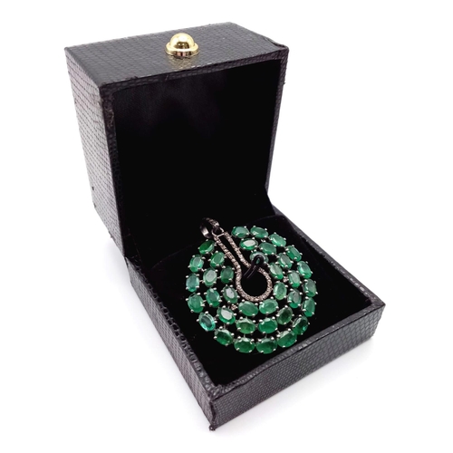 226 - An Emerald Circular Pendant with 13.55ct of Emeralds and 0.40ct of Diamond Accents set in 925 Silver... 