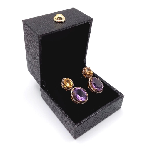 240 - A Pair of Amethyst and Citrine Gemstone Drop Earrings with Diamond Surrounds. Set in 925 gilded Silv... 