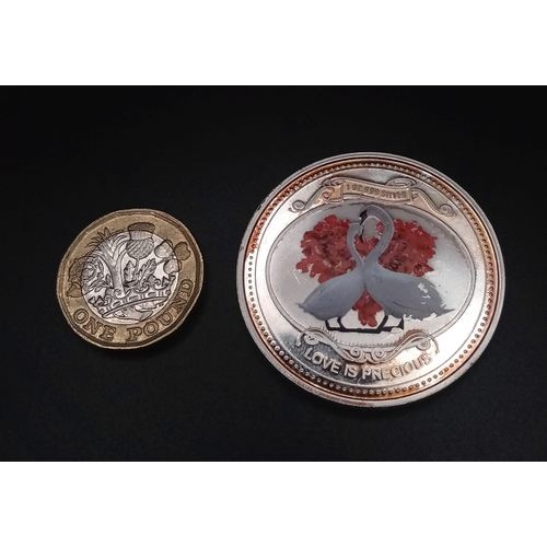 269 - 1 0Z OFF 999 FINE SILVER COIN WITH LOVE BIRDS ON AND THE WORDS LOVE IS PRECIOUS. TOTAL WEIGHT 31.3G