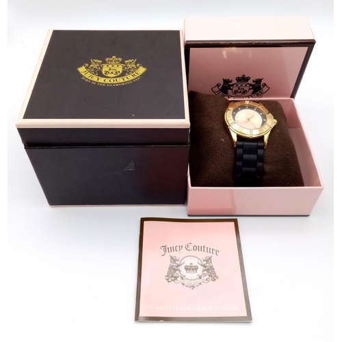 484 - An Excellent Condition Stone Set Bezel Gold Tone Sports Watch by Juicy Couture. 39mm Including Crown... 