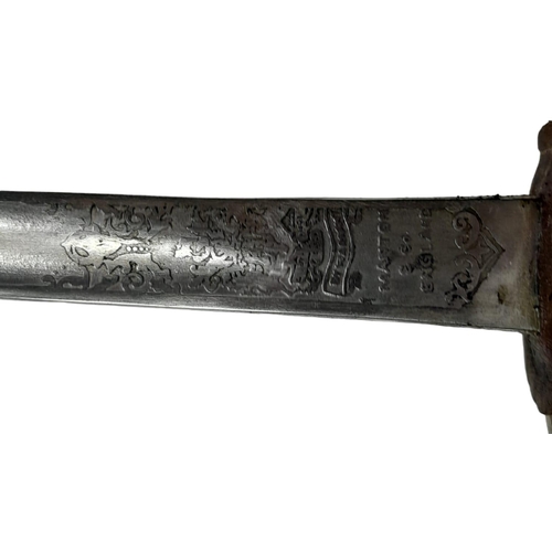 1719 - An Antique Navy Officer's Sword and Scabbard - By Manton and Co. of England. Etched blade. Decorativ... 