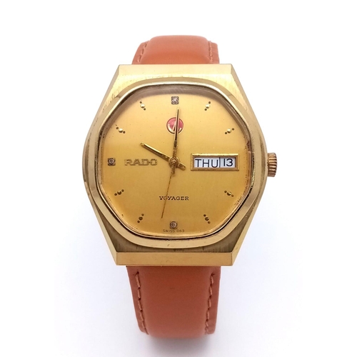 1032 - A Rado Voyager Automatic Gents Watch. Brown leather strap. Gilded stainless steel case - 36mm. Gilde... 