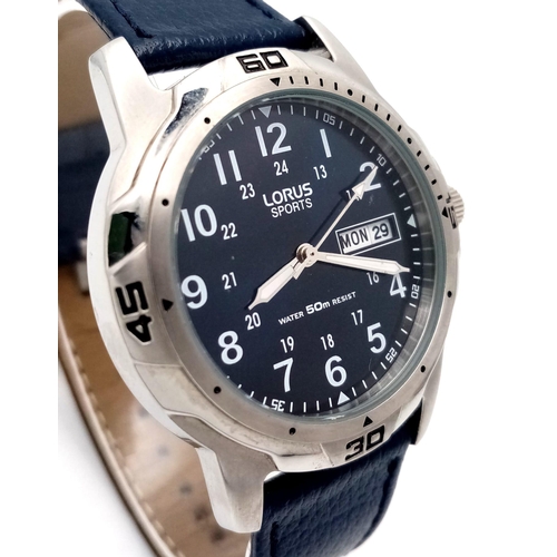 1053 - A Gents Sports Lorus Watch. Blue leather strap. Stainless steel case - 38mm. Blue dial with day/date... 